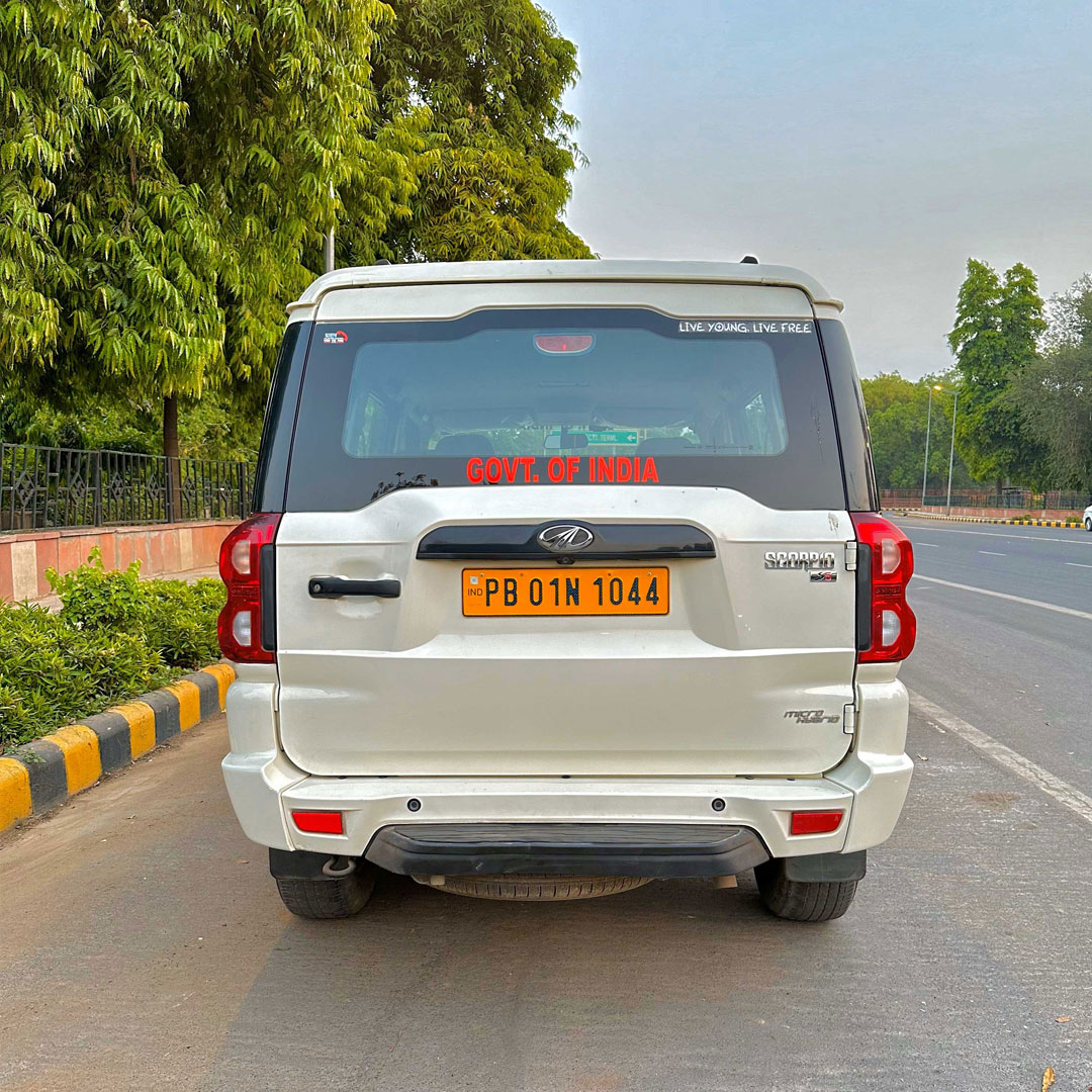 White Mahindra Scorpio rental car